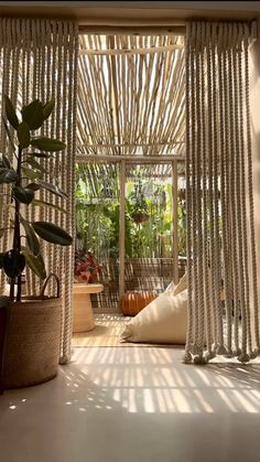 the inside of a house with plants and potted plants