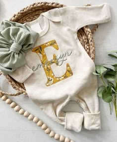 Personalized Baby Romper Embroidered Monogram - The Perfect Newborn Outfit This adorable outfit isn't just a Newborn Coming Home Outfit; it's a warm embrace for your little one's first moments in this world. This outfit makes a perfect coming-home outfit, newborn picture, or baby shower gift. This features a soft oatmeal color romper that is soft and comfortable to snuggle a little one. The name is in all lowercase letters, as shown in all of the listing photos. If specifically requested I can d Personalized Newborn Outfit, Baby Girl Sleepers, Baby Sleeper, Outfit Baby Shower, Newborn Coming Home Outfit, Baby Sleepers