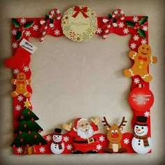 a christmas photo frame with santa claus and other holiday decorations on the bottom, along with snowmen