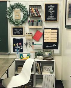 there is a desk and chair in the room with many bookshelves on the wall