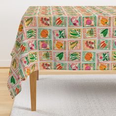 an image of a table cloth with fruit and vegetables on it in front of a white rug