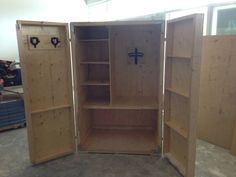 two open wooden cabinets in a room