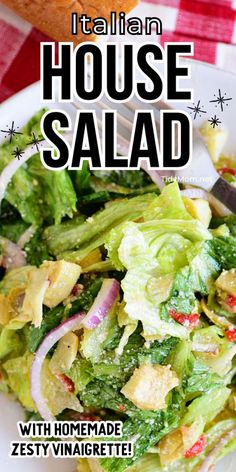 a salad with lettuce, onions and tomatoes on it is featured in the cover of italian house salad