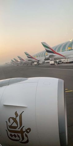 several airplanes are lined up on the tarmac at an air port run - way