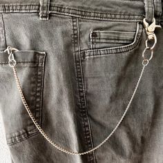 Steel curb wallet chain Double strands or single. This sleek curb chain  link is 1/4" wide. Not too heavy but sturdy. Two styles! Double wallet chain has  One 14" chain and one 12" chain for a total length of 19" end to end Or you can get one  14" chain for a total length of 19" as a single chain ( as pictured) Or 12" chain for a total length of 17" on one shorter wallet chain. Curb link is nickel plated steel. 1 beefy lobster claw clasp to attach to belt loop on one end. Key ring 1 1/2" on the Safe Journey, Key Wallet, Short Wallet, Wallet Chain, Curb Chain, Key Holder, Lobster Claw, Key Ring, Key Chain