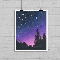 the night sky with stars and trees against a white brick wall in front of a black frame