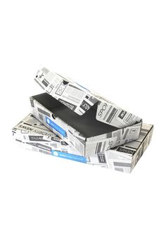 three newspapers stacked on top of each other in a stack with one folded up and the other open