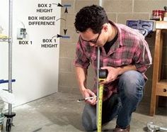 a man is measuring the floor with a tape measure