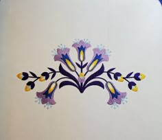 an embroidered design on the side of a white wall with blue and yellow flowers in it