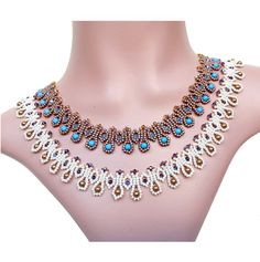 an elaborate necklace with blue and white beads on a mannequin neckline,