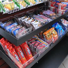 an assortment of snacks on display in a grocery store