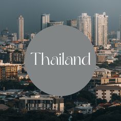 the word thailand in front of a cityscape