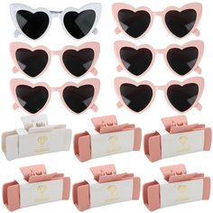 12 pairs of heart shaped sunglasses in pink and white frames with matching case for each pair