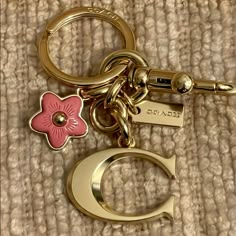 Nwt Coach Signature "C" Bag Charm Plated Brass & Resin Keychain/ Key Fob / Bag Charm. Brand New & 100% Authentic! Style: #. Color: Im / Gold Brass & Rose Resin And Metal Attached Split Key Ring And Dogleash Clip Cute Girly Keychains, Cute Small Keychains, Cute Keychains For Car Keys And Wallet, Coach Bag Charms, Keychain Aesthetic Car Keys, Coach Bag Charm, Cute Etsy Finds, Backpack Accessories Keychain, Cute Car Keys Keychains Ideas