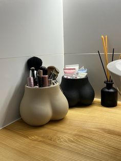 ntroducing the ultimate fusion of functionality and charm: our booty shaped ceramic makeup organizer. Designed to add a playful touch to your vanity, this delightful piece doubles as both a makeup organizer and a decorative accent for your space. Crafted from high-quality natural clay, this desktop organizer boasts a unique shape reminiscent of a curvaceous derrière, injecting a sense of whimsy and personality into your makeup routine. Its ample storage space is perfect for stashing your favorit Makeup Holders, Ceramic Organizer, Makeup Brush Holder, Makeup Holder Organizers, Makeup Caddy, Makeup Holder, Makeup Table, Makeup Brush Holders, Bestie Gifts