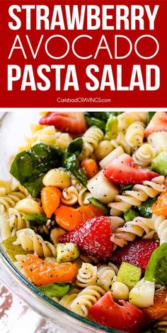 strawberry avocado pasta salad in a glass bowl