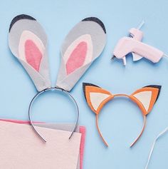 some bunny ears are next to a pair of scissors