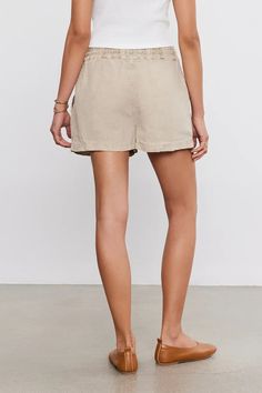 Made from a mid-weight linen that strikes the perfect balance between comfort and durability. With its relaxed fit and elastic drawstring waist, these shorts are ideal for relaxing days or beachside adventures. Complete with slash patch pockets for added convenience, they're the ultimate warm-weather essential. Relaxed Summer Bottoms With Pull-on Style, Vacation Bermuda Shorts With Elastic Waistband, Beige Relaxed Fit Bottoms For Beach Season, Relaxed Cotton Shorts For Beach Season, Relaxed Fit Beige Bottoms For Beach Season, Linen Bottoms With Built-in Shorts For Vacation, Linen Bermuda Shorts With Built-in Shorts And Relaxed Fit, Beach Linen Bottoms With Elastic Waistband, Comfortable Relaxed Fit Summer Bottoms