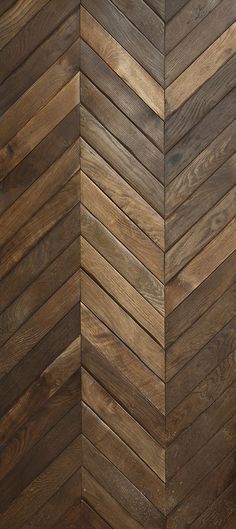 an image of wood flooring that looks like herringbones or chevron boards