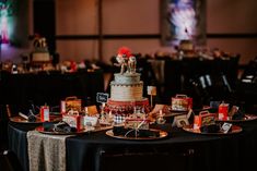 a table topped with a multi layered cake