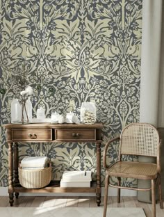 a room with a table, chair and wall paper