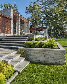 a modern house with stone steps leading up to it