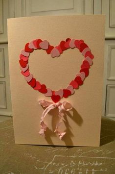 a heart shaped card on top of a table