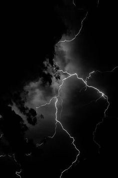 a black and white photo of lightning in the sky