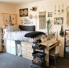 a bedroom with a bed, desk and other items on the wall next to it