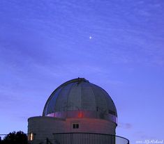 a very large dome with a bright red light on it