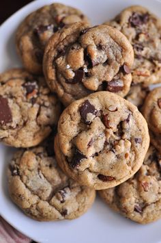 a plate full of chocolate chip cookies on a table