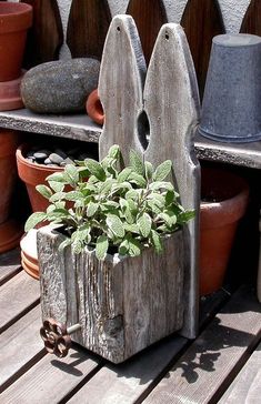 a wooden planter sitting on top of a wooden table