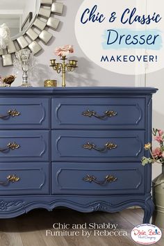 the dresser is painted blue and has gold hardware on it's drawers, along with an ornate mirror