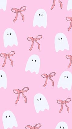 a pink background with ghost heads and bows