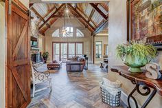 the inside of a house with wood and tile floors