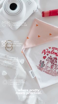 an image of valentine's day napkins on a table with camera and other items