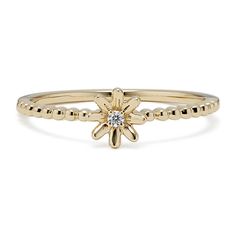 This dainty 14-karat yellow gold flower ring features a natural diamond accent at its center and beautiful beading along the band. Stack this versatile ring along with favorites  or let it shine on its own. Stackable Diamond Rings, Gold Flower Ring, Let It Shine, Step Kids, Flower Ring, Fashion Rings, Natural Diamonds, Diamond Ring, Yellow Gold