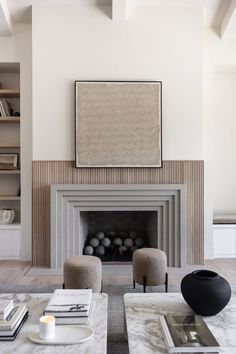 a living room with two chairs and a fireplace