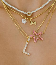 Icy & Luxe! Our statement initial necklace features a jumbo-sized, 14K Gold-plated blingy CZ letter pendant set on a hypoallergenic (allergy-free) Gold-plated ball chain necklace made of hypoallergenic brass metal. Perfectly dainty and lightweight. Choose your frosty initial from the drop down. Limited supply only. Preppy Gold Necklaces, Preppy Jewelry Necklaces, Cute Jewelry Aesthetic, Dainty Necklace Stack, Necklace Stacking Gold, Gold Necklace Stack, Necklace Stacks, Summer Jewelry Trends, Lucky Charm Necklace