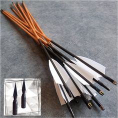 an assortment of different types of arrows on the ground