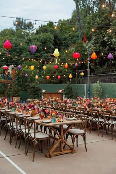 tables and chairs are set up with paper lanterns