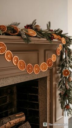 an orange slice garland is hanging on the mantle