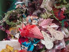 a pile of different colored flowers and leaves