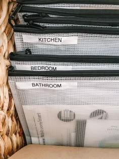 there are four different types of bathroom baskets in the closet, each with labels on them