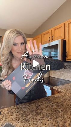 a woman in a kitchen holding up an item with the words american kitchen finds on it