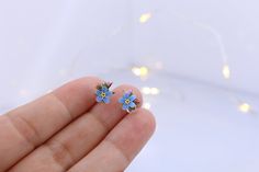 Handmade stud earrings with forget-me-not flowers Made of polymer clay, the flower is not fragile, it has flexible petals. Sold in a gift box. Flower size about 7x7 mm (0.27 inches x 0.27 inches) ❤ flexible petals ❆ not afraid of the cold ☔ not afraid of water All my products you will receive in a gift box! ❀ Please feel free to send me a message if you have any question. Add your valid phone number to the order's note It will be add to the package for better post service Handmade Blue Whimsical Flower Earrings, Whimsical Blue Flower Earrings For Gift, Whimsical Handmade Blue Flower Earrings, Blue Flower-shaped Earrings For Gifts, Delicate Blue Flower Earrings With Ear Wire, Light Blue Flower-shaped Jewelry With Matching Earrings, Cute Blue Flower Shaped Jewelry, Delicate Blue Flower Shaped Earrings, Cute Blue Flower Jewelry