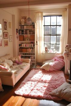 a living room filled with lots of furniture and bookshelves next to a window