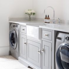 a washer and dryer in a white room