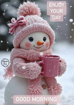 a snowman holding a coffee cup and wearing a pink knitted hat with the words, enjoy your day good morning