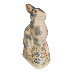 a ceramic rabbit figurine sitting on its hind legs